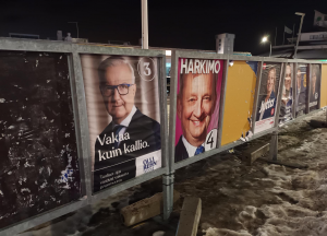 Large posters in the street depicting 2024 Finnish presidential election candidates.
